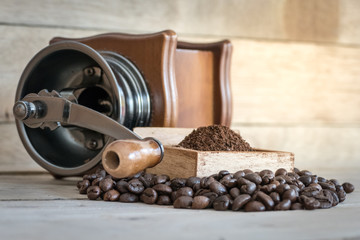 old vintage coffee grinder with coffee beans
