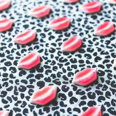 candy mouth lips on dark trendy background, minimal theme and design