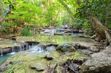 Beautiful waterfall and tropical forests at Erawan National Park is a famous tourist attraction in Kanchanaburi Province, Thailand © yongkiet