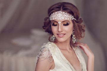 Studio portrait of beautiful bride with perfect hairstyle and ma © vickyrandom