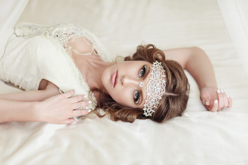 Studio portrait of beautiful bride with perfect hairstyle and ma © vickyrandom