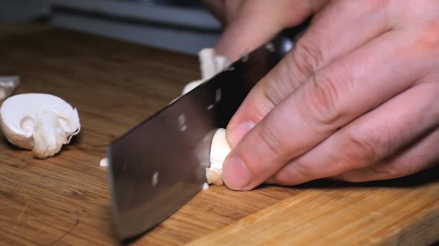 Knife Cut Mushrooms Cooking - cutting mushrooms in the kitchen.