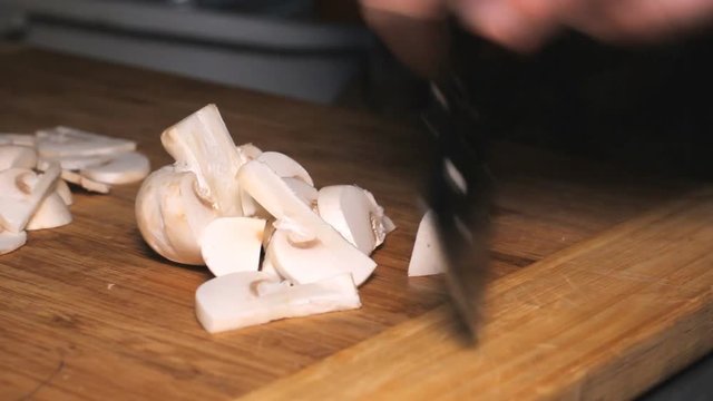Knife Cut Mushrooms Cooking - cutting mushrooms in the kitchen.