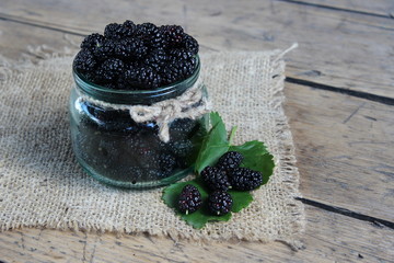 Fototapeta na wymiar Mulberry berries in a jar