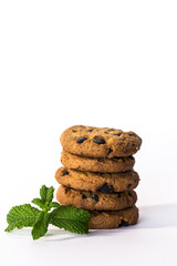 chocolate chip cookies on rustic wooden table isolated