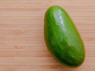 Fresh avocado on wooden background. Organic avocado healthy food
