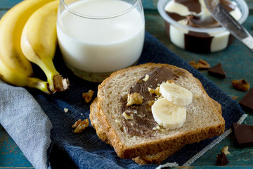 Cooked breakfast with toast bread, chocolate cream butter and a