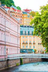 Colorful hotels and traditional buildings on sunny town of Karlovy Vary. The most visited spa town in the Czech Republic.