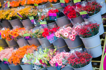 Street flower market with various multicolored fresh flowers outdoors in Europe