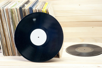 Vinyl record with copy space in front of a collection of albums dummy titles , vintage process