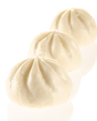 Chinese steamed buns isolated on white with light reflection