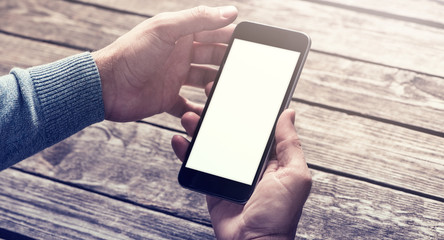 Smartphone in hands. Clipping path included.