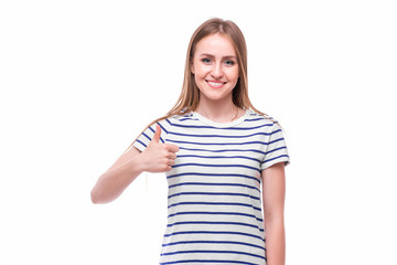 Fototapeta premium Girl with thumbs up on white background. People emotions concept.