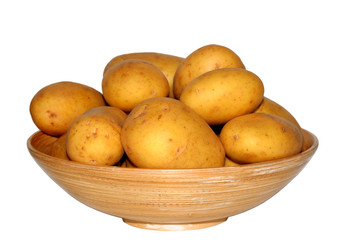 New potato in wood bowl isolated on white background