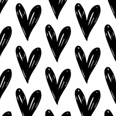 Vector seamless pattern with hand drawn doodle black hearts.