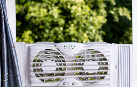 Window Fan Ready To Cool Down Room In Home During Hot Weather