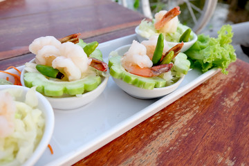 boiled shrimp on bitter melon as Thai fusion food style arranged on plate