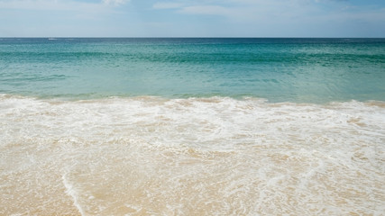 Rippling water surface of sea. Sea waves with white foam background wallpaper. Surface of wave in the blue tone color from ocean.