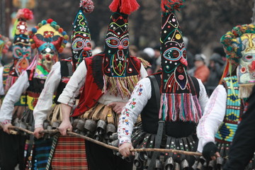 Pernik, Bulgaria - January 14, 2008: Unidentified man in traditional Kukeri costume are seen at the...