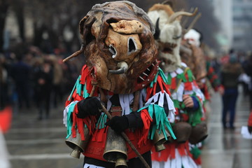 Pernik, Bulgaria - January 14, 2008: Unidentified man in traditional Kukeri costume are seen at the...