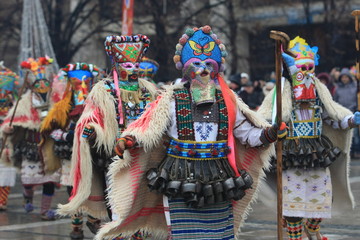 Pernik, Bulgaria - January 14, 2008: Unidentified man in traditional Kukeri costume are seen at the...
