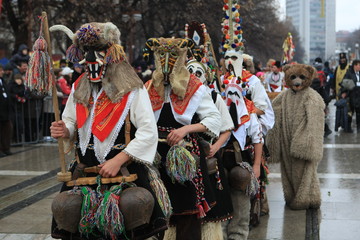 Pernik, Bulgaria - January 14, 2008: Unidentified man in traditional Kukeri costume are seen at the...