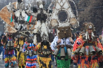 Pernik, Bulgaria - January 14, 2008: Unidentified man in traditional Kukeri costume are seen at the Festival of the Masquerade Games Surva in Pernik, Bulgaria.