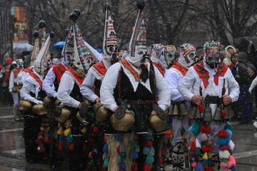 Fototapeta na wymiar Pernik, Bulgaria - January 14, 2008: Unidentified man in traditional Kukeri costume are seen at the Festival of the Masquerade Games Surva in Pernik, Bulgaria.