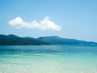 Beautiful Island in ocean sea with crystal green blue water sea and clear blue sky. Happy summer time concept.