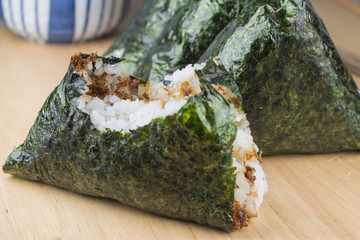 Rice ball (onigiri) with bite mark