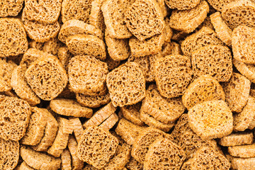Many small dried rusks  as texture background.