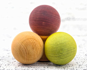 Arrangement of colored wooden balls