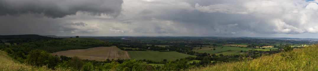 Fototapeta na wymiar Panoramic view with storm clouds coming over the Chilterns, Engl