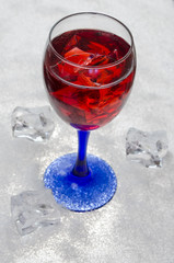cherry juice with ice on a white background