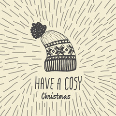 Christmas vintage card with with hand drawn knitted winter hat and text 'Have a Cosy Christmas'