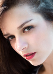 Obraz premium Young girl closeup beauty portrait. Natural beauty female model face. Calm and cute beautiful face with loving sensual eyes