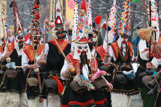 Pernik, Bulgaria - January30, 2010: Unidentified man in traditional Kukeri costume are seen at the Festival of the Masquerade Games Surva in Pernik, Bulgaria.