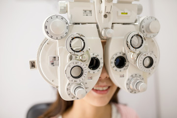 Woman having optometry machine vision
