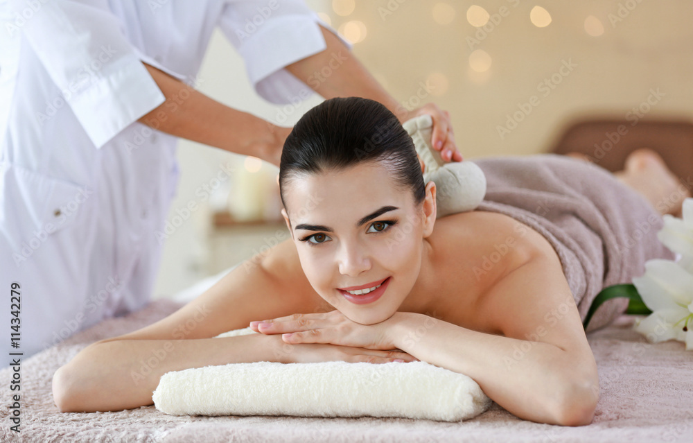 Poster Young woman having spa procedures at the beauty salon