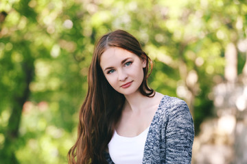 Fototapeta premium Portrait of beautiful girl in park