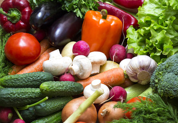 Background of fresh vegetables and greens closeup