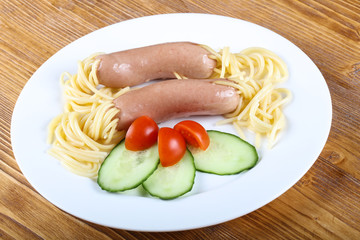 Kids spaghetti with sausages