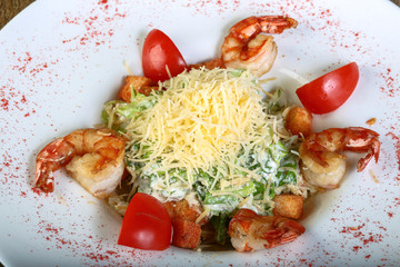 Caesar salad with tiger shrimps
