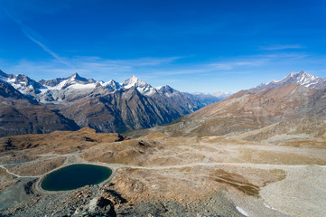 Alps mountain and lake with clear blue sky