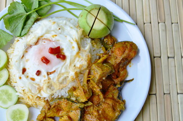 spicy catfish curry and fried egg on rice