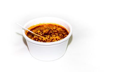 Instant noodle food with hot water in white plastic foam cup