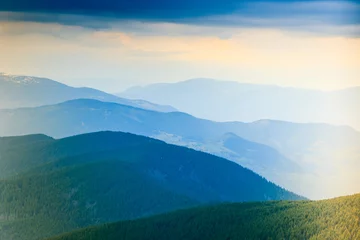 Poster Landscape of misty mountain hills at distance. © vovik_mar