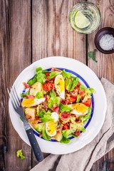 potato salad with eggs, lettuce,  tomatoes and bacon