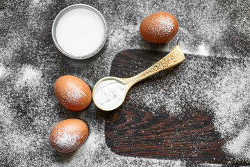 Ingredients for the preparation of bakery products. Bread, flour, eggs and cherry tomatoes.