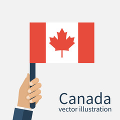 Fototapeta na wymiar Canadian flag holding in hands